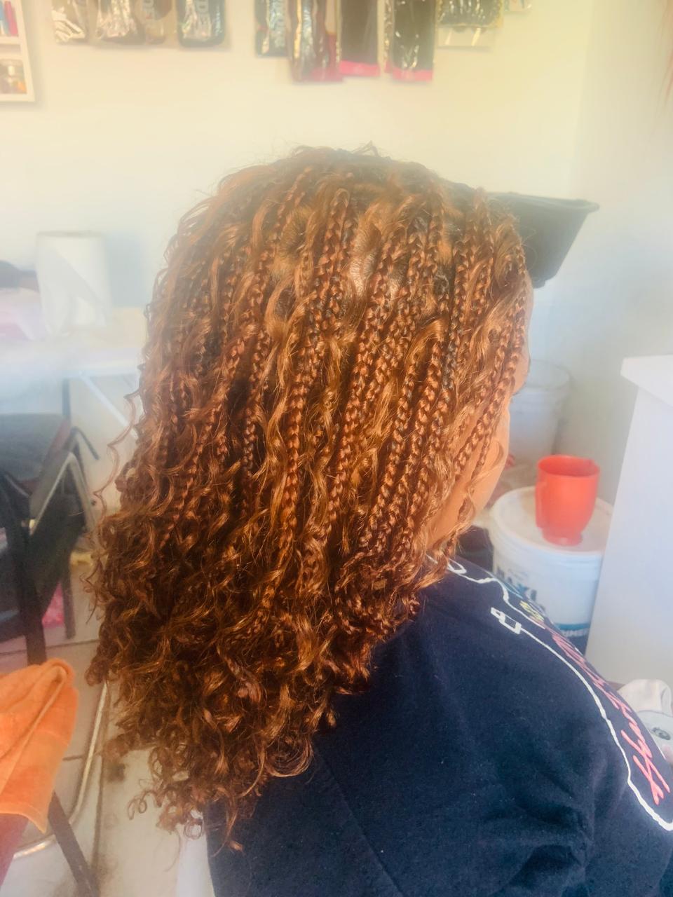 Copper knotless braids with spiral curls